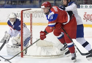 POPRAD, SLOVAKIA - APRIL 20: Russia's Andrei Svechnikov #14 stickhandler the puck while being checked by Slovakia's Daniel Demo #18 during quarterfinal round action at the 2017 IIHF Ice Hockey U18 World Championship. (Photo by Andrea Cardin/HHOF-IIHF Images)